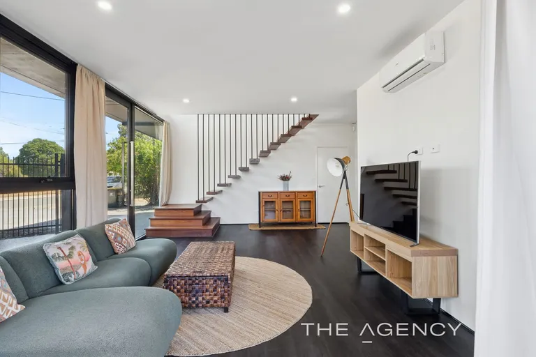 Open-plan living with floating staircase