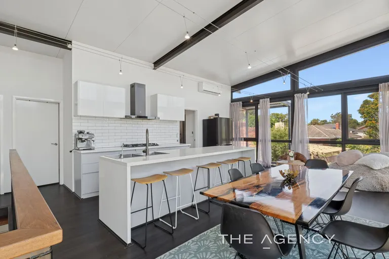 Kitchen and dining under cathedral ceiling